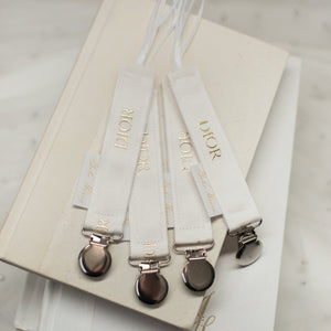 Dior Off-White Pacifier Clip