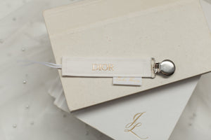 Dior Off-White Pacifier Clip